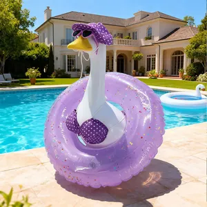 Porch goose dressed in purple polka-dot bikini and sun hat with inflatable ring detail.