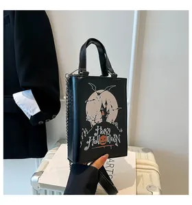 Black square crossbody bag with spooky Gothic castle and Happy Halloween print detail