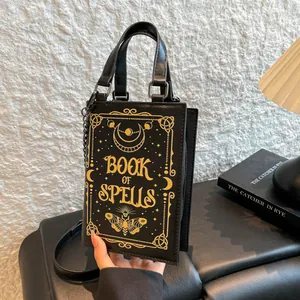 Unique gothic book-shaped crossbody handbag with 'Book of Spells' gold print