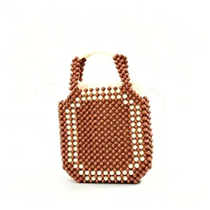 Elegante borsa a mano in perline marroni e crema fatta a mano per spiaggia e viaggi
