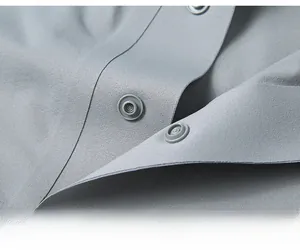 Detailed close-up showing the hidden snap button design on a grey breathable polo shirt