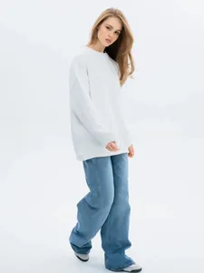 Oversized white crewneck sweatshirt with minimalist drop shoulder design