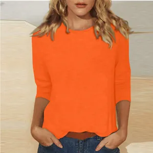 Vue détaillée d'un t-shirt femme orange vif à manches 3/4 et col rond décontracté