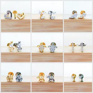 Collage of F136 titanium labret studs in heart, snake, turtle and puppy shapes with CZ