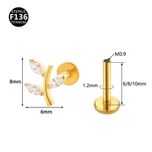 F136 Titanium leaf labret stud with marquise crystals and precise dimension details.
