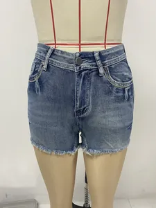 Detailed view of American retro slim denim shorts featuring raw hem and washed blue finish