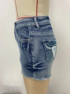 Detailed side view of American vintage slim denim shorts featuring blue floral embroidery