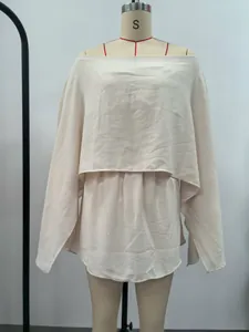 Elegant beige off-shoulder top with cape slit sleeves and elastic waist detail.