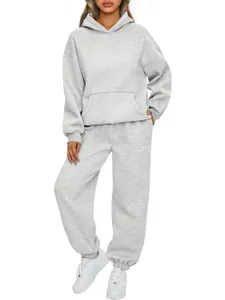 Full view of women's casual grey two-piece hooded tracksuit set on white background