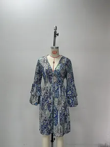 Women's paisley print summer dress with multi-layered bell sleeves on mannequin