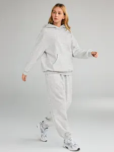 Detail of grey oversized hoodie and joggers set on model for autumn winter wear