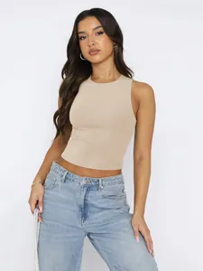 Detailed view of a beige round neck sleeveless crop top for women's fitness and yoga