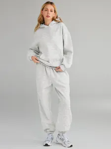 Detailed full-body view of women's gray oversized cotton hooded sweatshirt and pants set