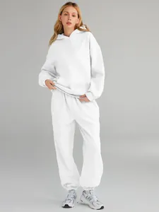Detail view of women's white oversized hoodie and matching sweatpants set