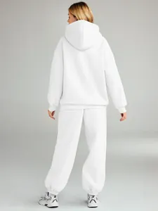 Detailed back view of a stylish white oversized hooded tracksuit set for women in winter