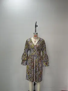 Bohemian style V-neck paisley print midi dress with layered bell sleeves on mannequin.
