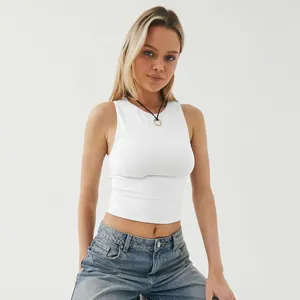 Close-up detail view of a white sleeveless crop top for women's sports and yoga fitness