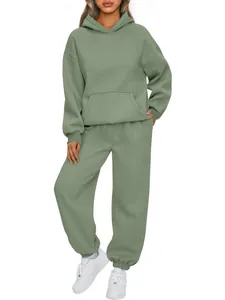 Full body view of women's sage green oversized hoodie and jogger tracksuit set