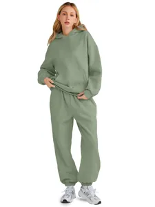 Detailed view of women's sage green oversized hooded sweatshirt and joggers set