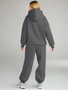 Detailed back view of women's oversized charcoal gray hoodie and sweatpants sportswear set