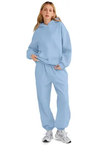 Full body view of a light blue oversized hoodie and joggers lounge set for women.