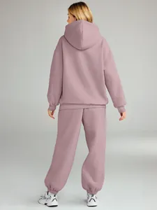 Back view detail of women's mauve oversized hoodie and matching joggers casual tracksuit