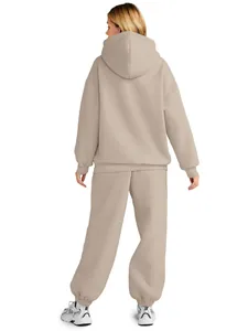 Back view of women's beige oversized hoodie and sweatpants set for autumn and winter
