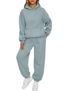 Detailed view of fabric texture and fit on a light blue hooded sweatshirt and jogger set