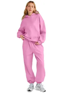 Premium women's pink two-piece tracksuit set featuring a hoodie and cozy sweatpants