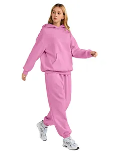 Side view showing details of pink women's hooded sweatshirt and loose-fit joggers set