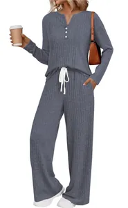 Detail view of women's grey-blue ribbed knit lounge set with long sleeves and wide pants