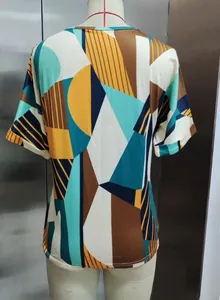 Detailed back view of women's T-shirt featuring a colorful geometric abstract print.