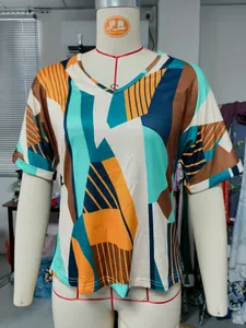 Detail view of women's summer V-neck T-shirt with vibrant geometric abstract print