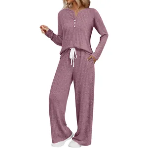 Detail view of a two-piece ribbed knit lounge set in dusty rose with wide-leg pants.
