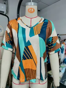 Close-up of women's summer V-neck T-shirt with stylish geometric color block print