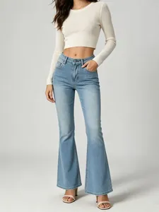 Detail shot of light blue high-waisted flared jeans with a flattering slim fit