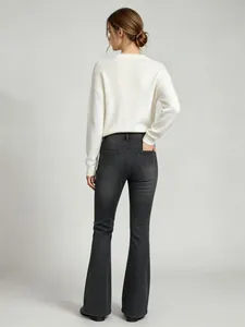 Back view of women's high-waisted micro-flare jeans in washed dark grey denim finish.