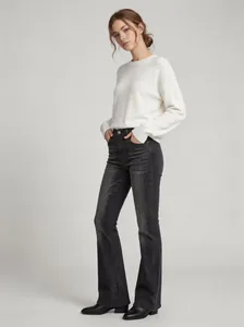 Stylish high-waist black flare jeans for women featuring a slim fit and vintage faded wash
