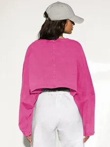 Back view of pink cropped long sleeve sweatshirt in a sporty minimalist style
