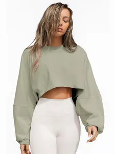 Close-up detail of a sage green long sleeve crop top sweatshirt for women's fitness