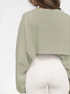 Back view detail showing the fabric texture of a sage green cropped long-sleeve sweatshirt