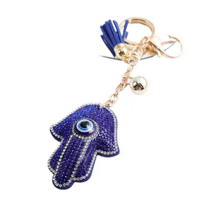 Élégant porte-clés Main de Fatma avec strass bleus et breloque à pompon sophistiquée