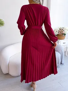Detailed back view showing the elegant pleated texture of this burgundy maxi dress.