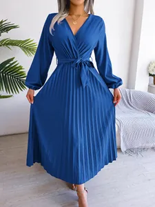 Elegant deep blue pleated maxi dress featuring a V-neckline and waist tie detail