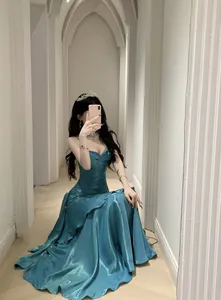 Elegant teal mermaid satin evening gown with ruffles and spaghetti straps