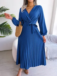 Elegant royal blue V-neck pleated maxi dress with long sleeves and waist belt
