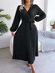 Elegant black V-neck pleated maxi dress with long sleeves and belted waist details