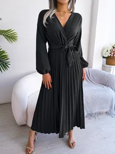 Elegant black V-neck long-sleeved pleated maxi dress with matching waist tie.