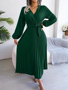 Elegant dark green V-neck pleated maxi dress with long sleeves and tie waist detail