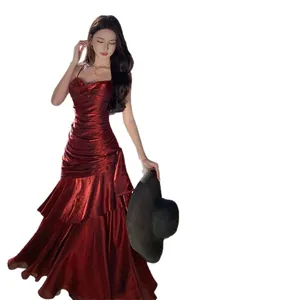 Elegant red metallic mermaid evening gown with ruffled tiers and spaghetti straps